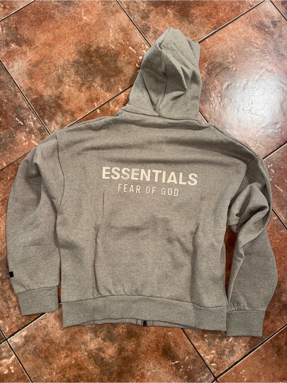 Fear of God Essentials Hoodie in Heather Gray with Cream Logo